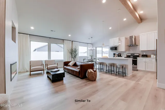 a kitchen with a refrigerator sink and cabinets
