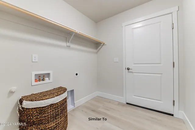 a view of room with furniture and wooden floor