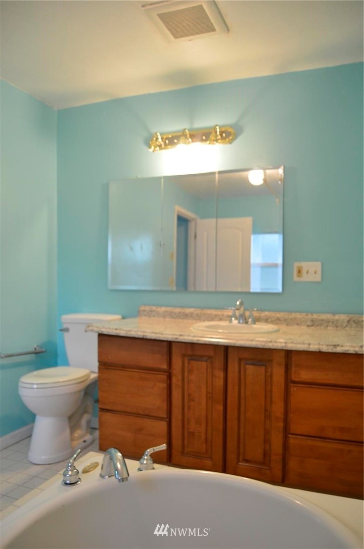 19215 Loganberry Street Southwest Rochester, WA 98579 - Photo 24 of 38 a bathroom with a sink and a toilet