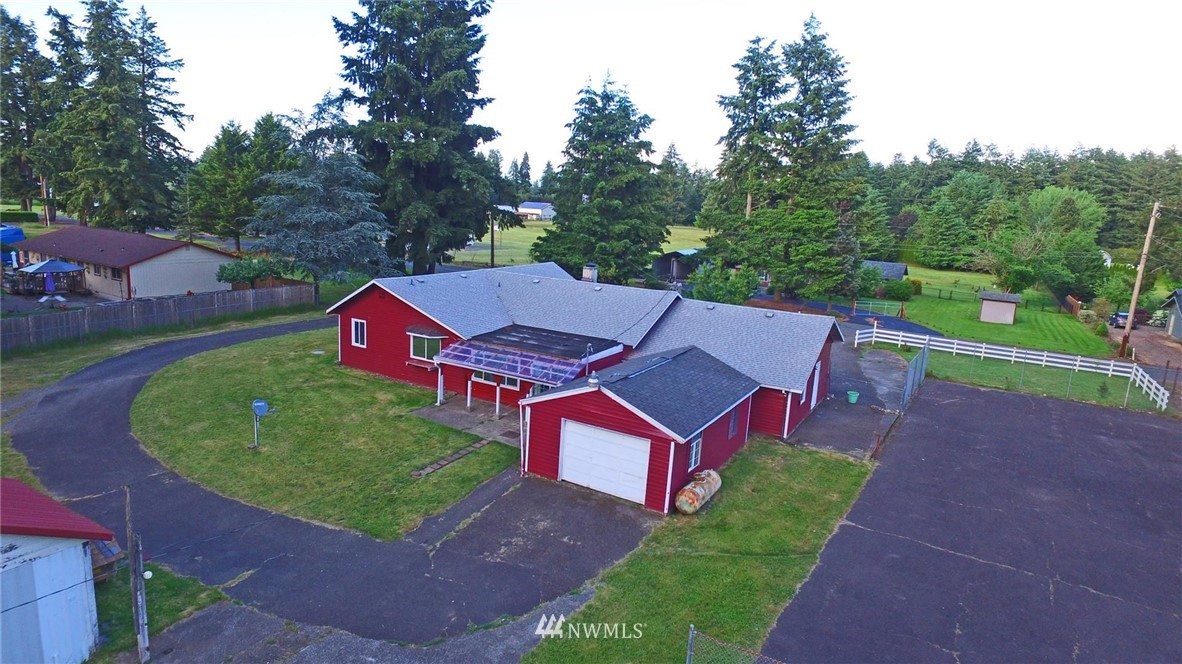 19215 Loganberry Street Southwest Rochester, WA 98579 - Photo 34 of 38 an aerial view of a house with backyard