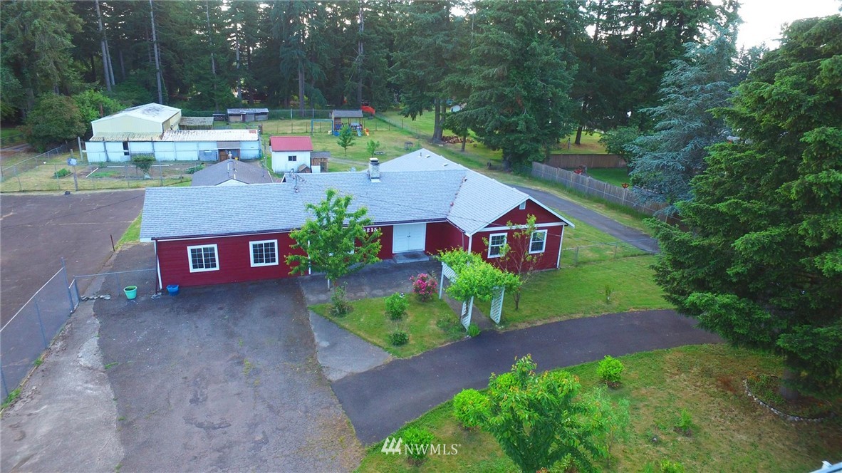 19215 Loganberry Street Southwest Rochester, WA 98579 - Photo 35 of 38 a view of a house with a yard and street view