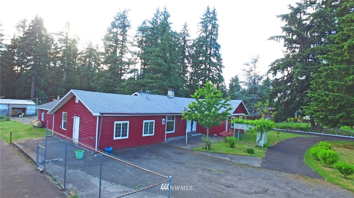 19215 Loganberry Street Southwest Rochester, WA 98579 - Photo 37 of 38 a front view of a house with yard