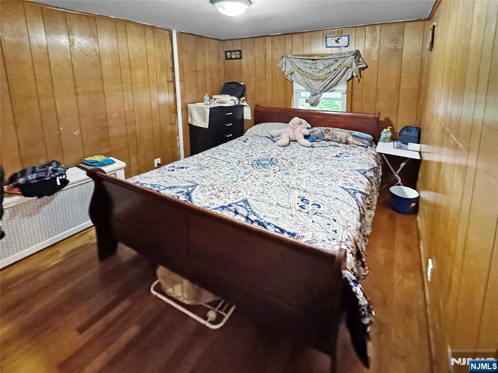 115 Kansas Street Hackensack, NJ 07601 - Photo 7 of 8 a bed sitting in a kitchen next to a window
