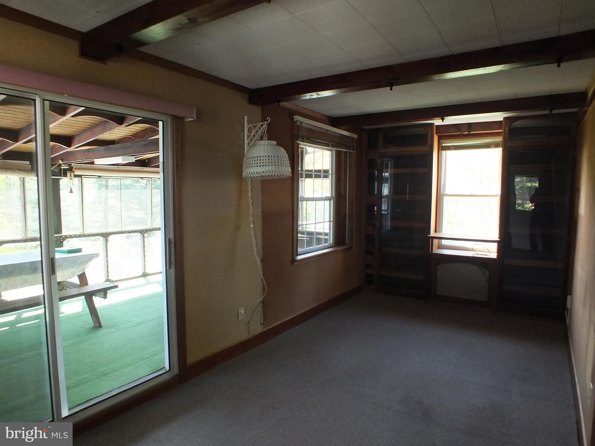 543 Poole Road Westminster, MD 21157 - Photo 17 of 31 Family room has sliders to the covered deck.