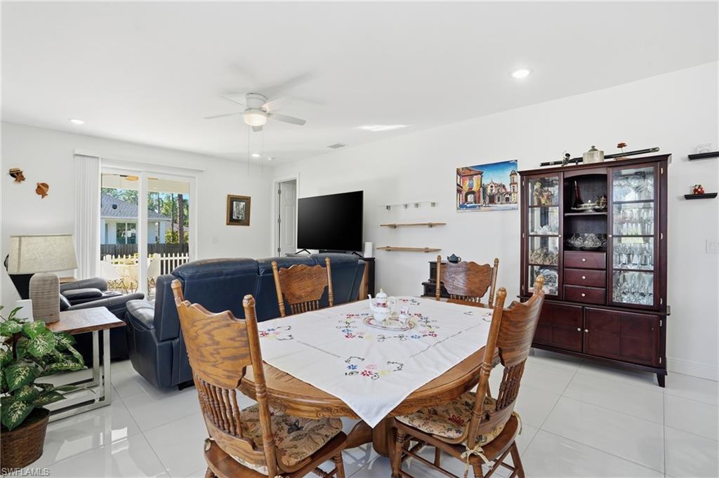 3409 64th Street West Lehigh Acres, FL 33971 - Photo 21 of 44 a view of a dining room with furniture