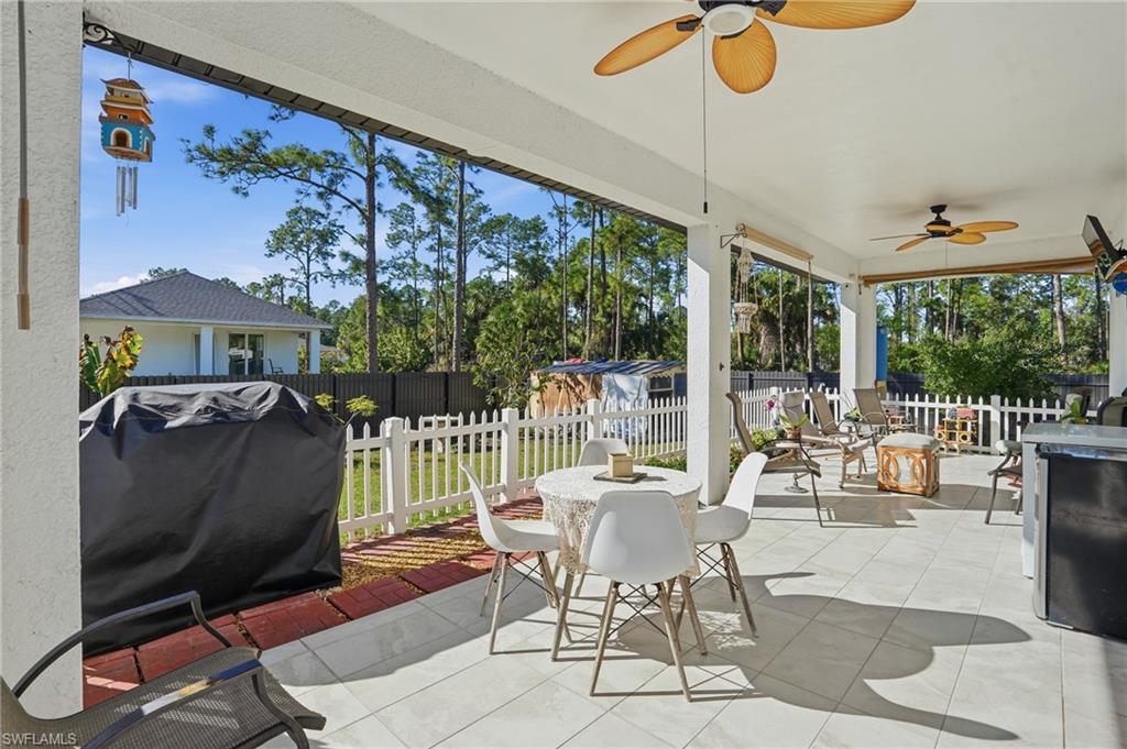 3409 64th Street West Lehigh Acres, FL 33971 - Photo 30 of 44 a balcony with furniture and a potted plant
