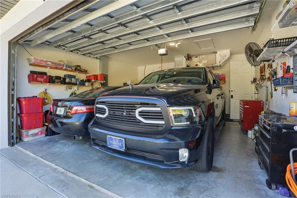 3409 64th Street West Lehigh Acres, FL 33971 - Photo 43 of 44 a view of car garage