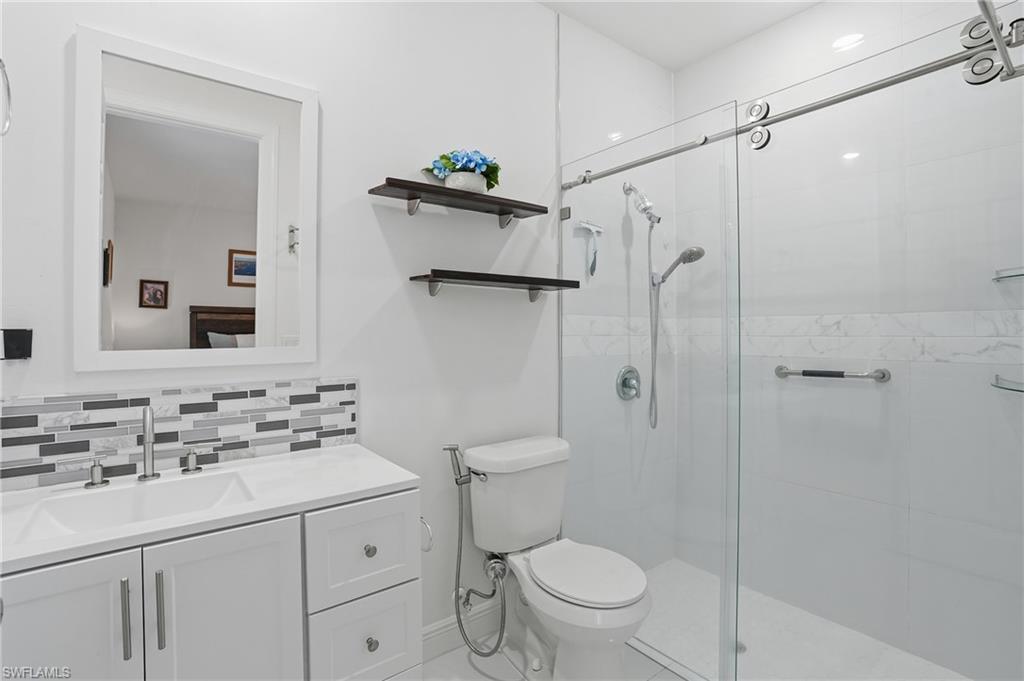 3409 64th Street West Lehigh Acres, FL 33971 - Photo 5 of 44 a bathroom with a sink toilet and shower
