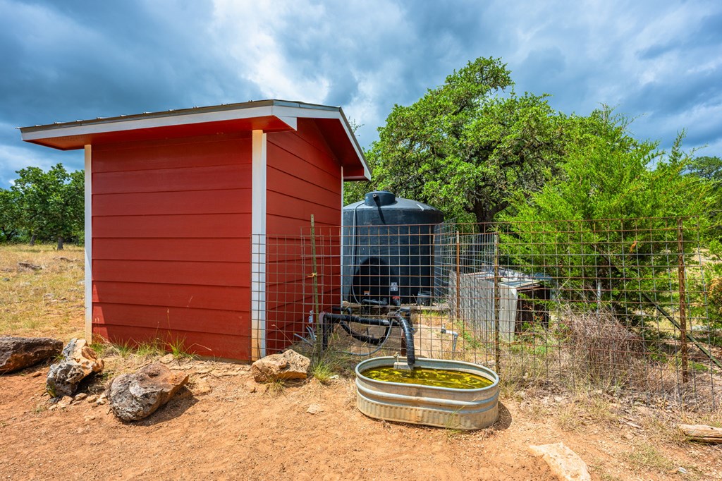 118 Re Ranch Road Kerrville, TX 78028 - Photo 27 of 36 Barn, There are 3 stalls, a tack room, and a storage loft upstairs.