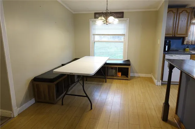 a bedroom with a bed and a chair with the outer view