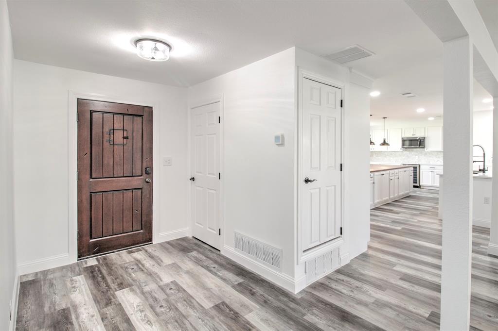 3884 Lois Road East Sanger, TX 76266 - Photo 9 of 40 a view of a hallway with wooden floor