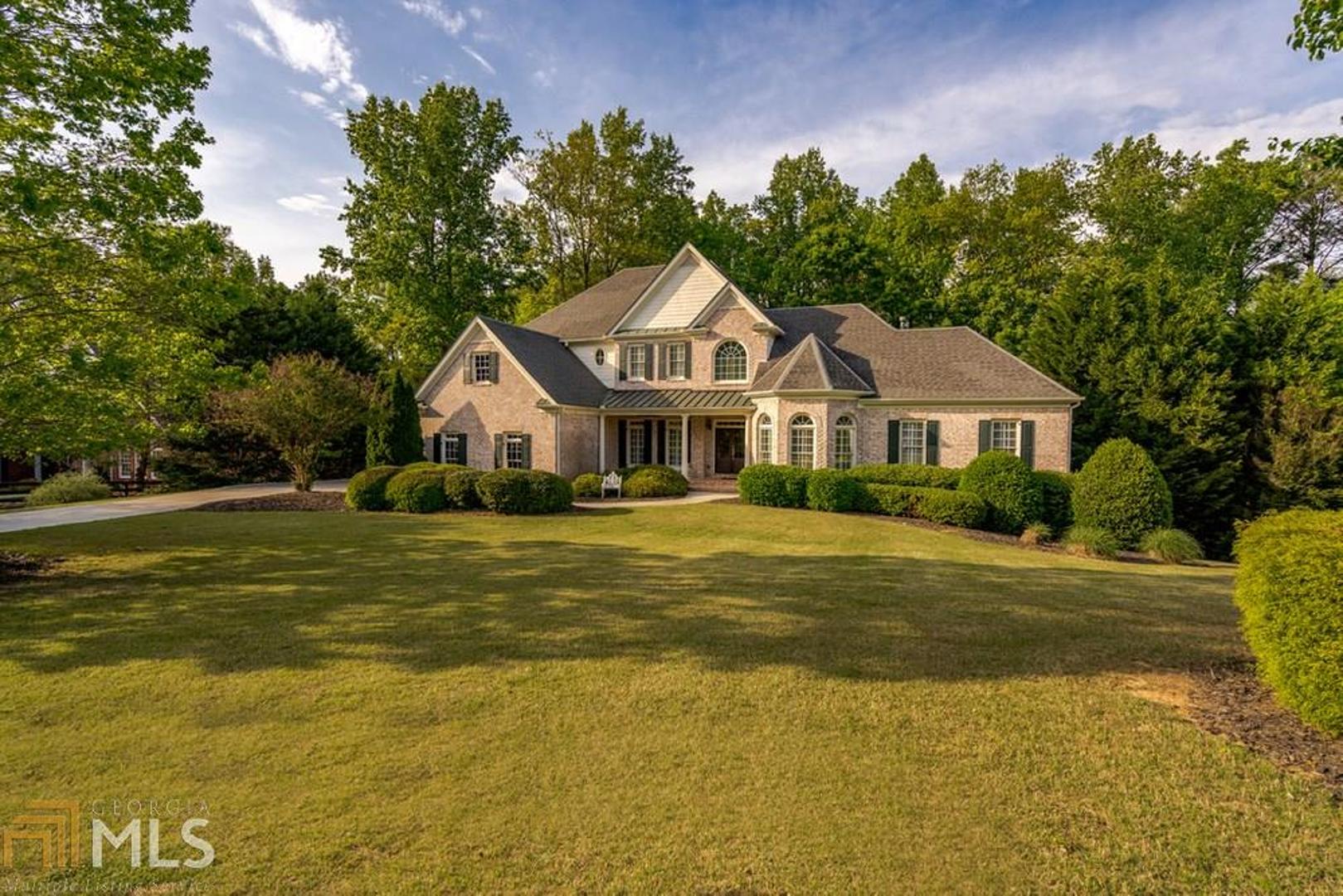 TOTAL TRANSFORMATION !!  Executive 4 sided brick home nestled in nature on over an acre of  privacy