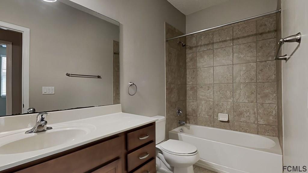 1504 Valhalla Way St. Augustine, FL 32092 - Photo 14 of 16 a bathroom with a sink toilet and shower