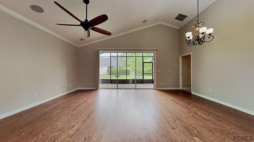 1504 Valhalla Way St. Augustine, FL 32092 - Photo 3 of 16 a view of an empty room with wooden floor and a window