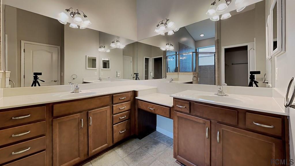 1504 Valhalla Way St. Augustine, FL 32092 - Photo 8 of 16 a bathroom with a sink double vanity and a mirror
