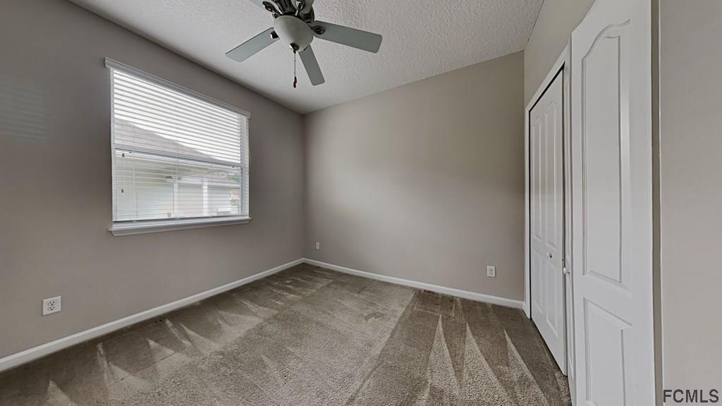1504 Valhalla Way St. Augustine, FL 32092 - Photo 10 of 16 a view of room with window and ceiling fan