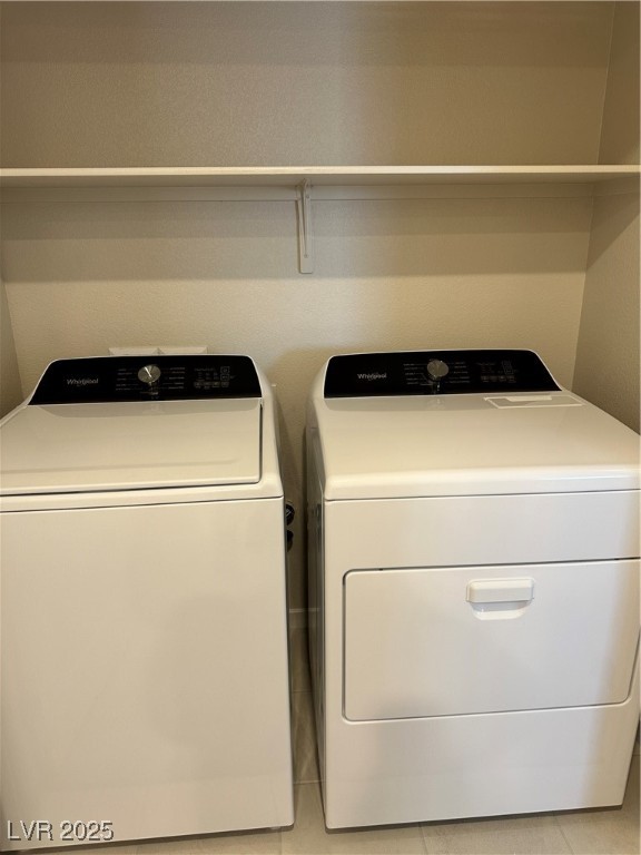 860 Angwin Lane Henderson, NV 89011 - Photo 5 of 9 Laundry area featuring light tile patterned flooring and separate washer and dryer