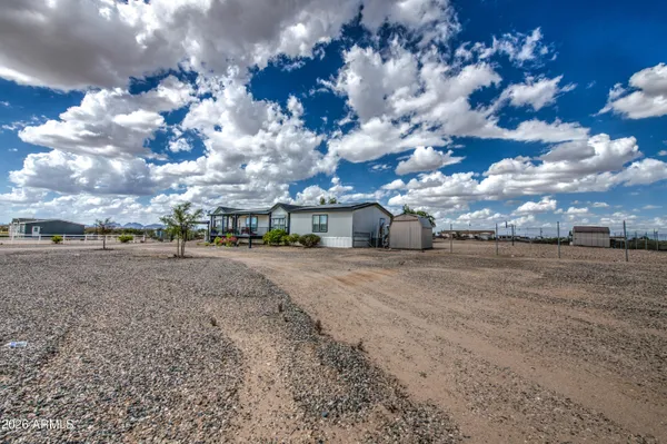 a view of multiple houses with a yard