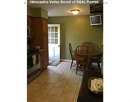 Kitchen. Eating area in kitchen. Patio located off the kitchen.