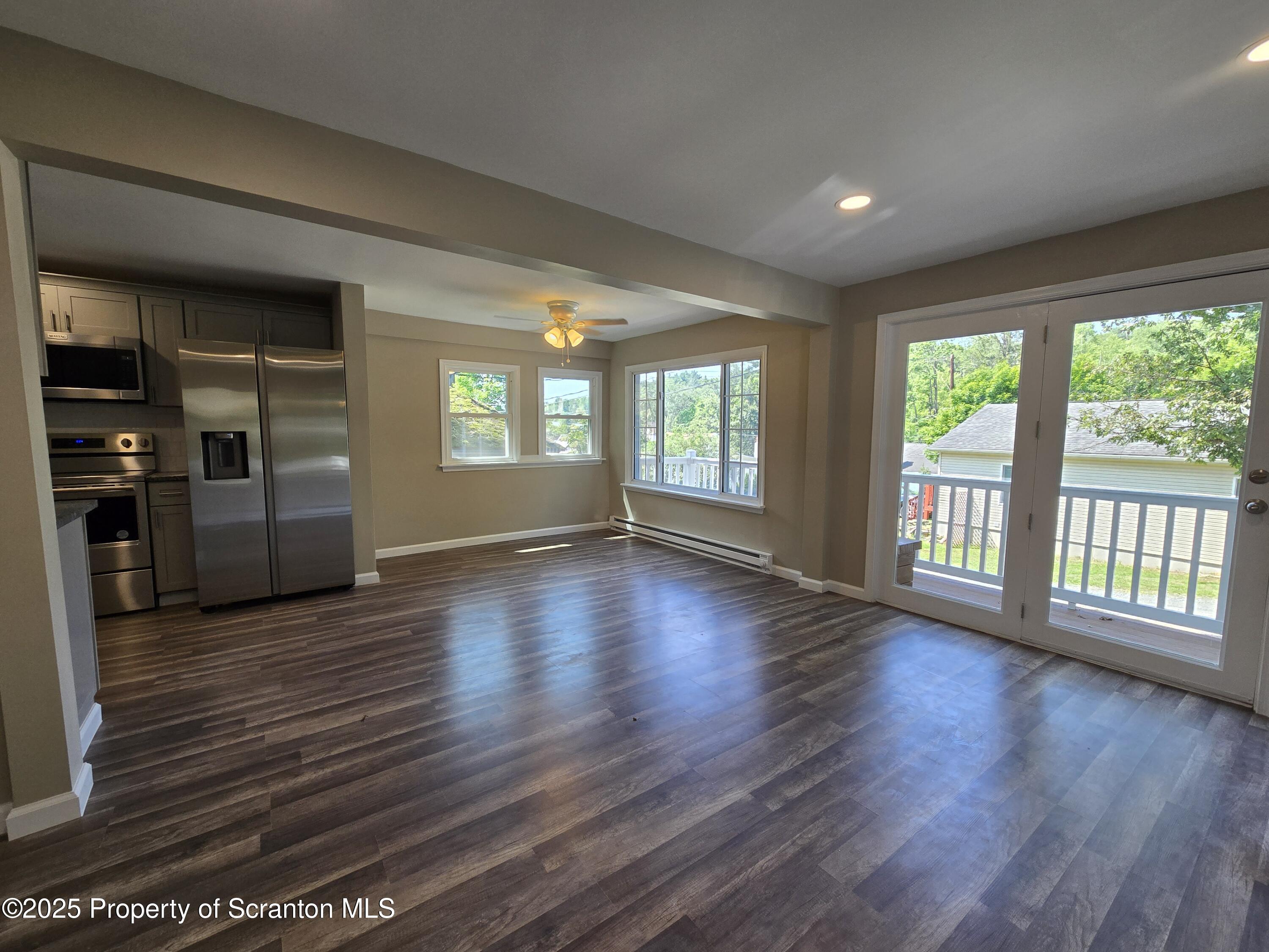 134 Chestnut Street Factoryville, PA 18419 - Photo 12 of 33 an empty room with wooden floor and windows