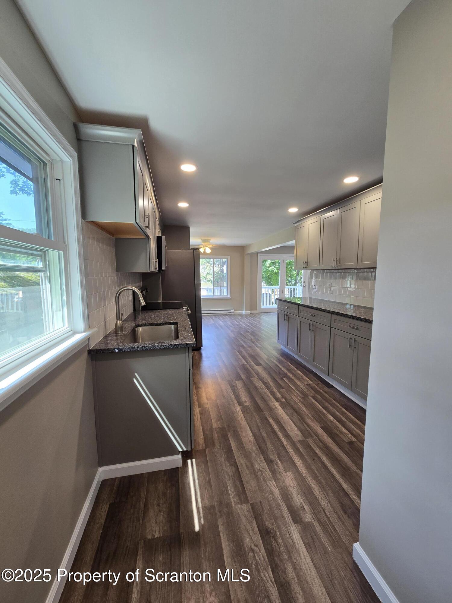 134 Chestnut Street Factoryville, PA 18419 - Photo 15 of 33 a kitchen with stainless steel appliances granite countertop a refrigerator and a sink