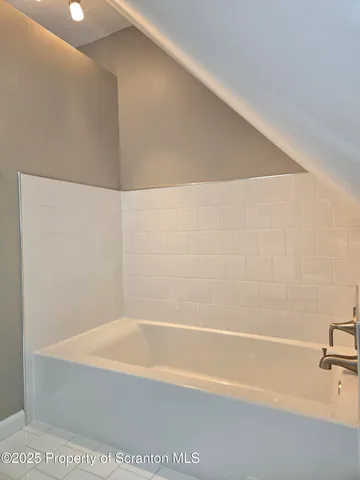 a bathroom with a bathtub