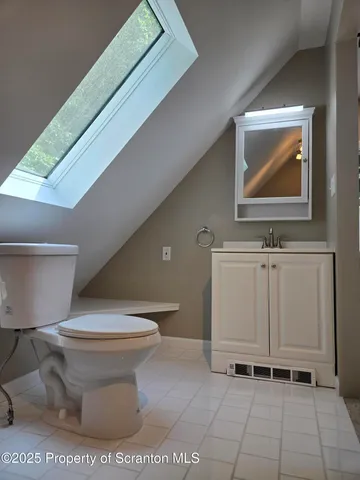 a bathroom with a toilet and a sink