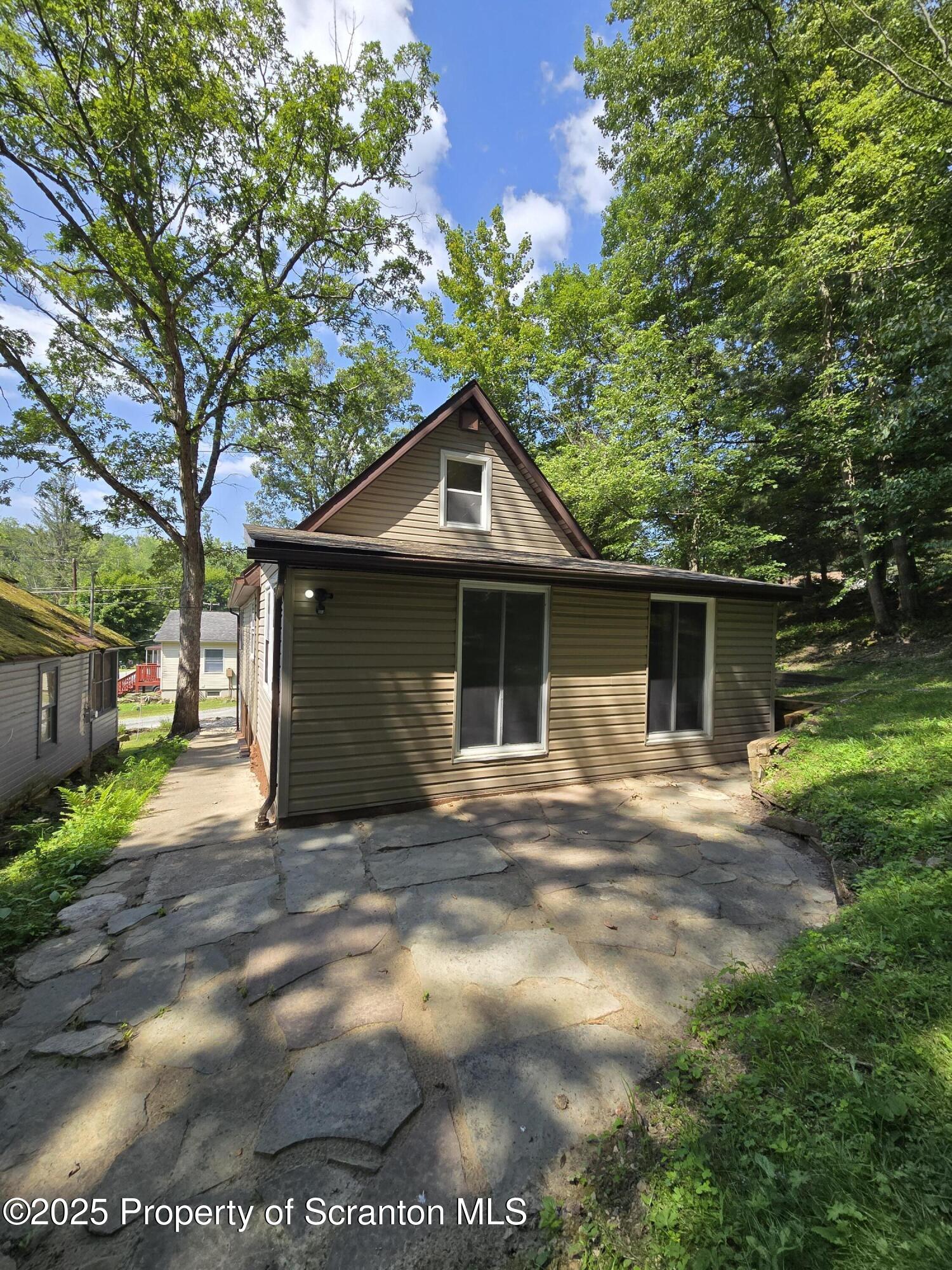 134 Chestnut Street Factoryville, PA 18419 - Photo 6 of 33 a front view of a house with yard
