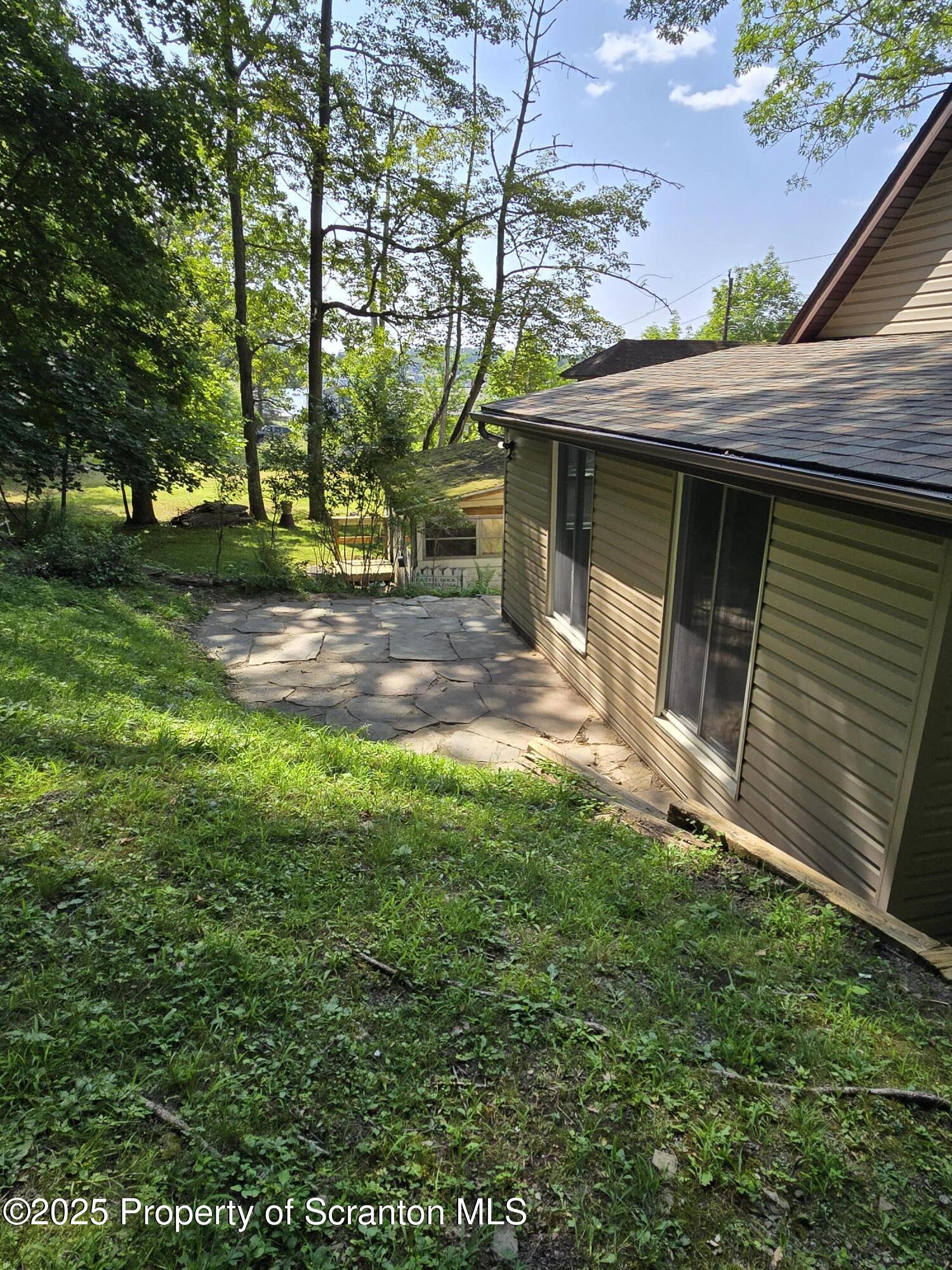 134 Chestnut Street Factoryville, PA 18419 - Photo 8 of 33 a view of a house with a yard