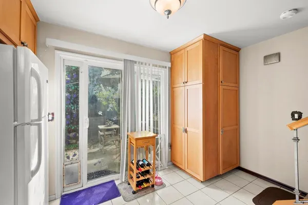 a view of a patio with table and chairs and potted plants