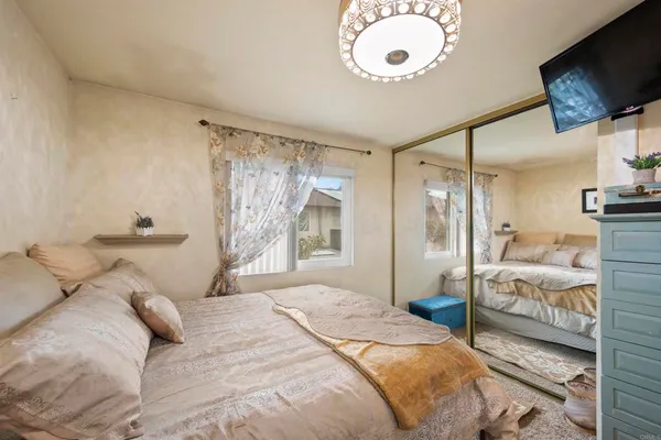 a view of backyard with swimming pool and green space