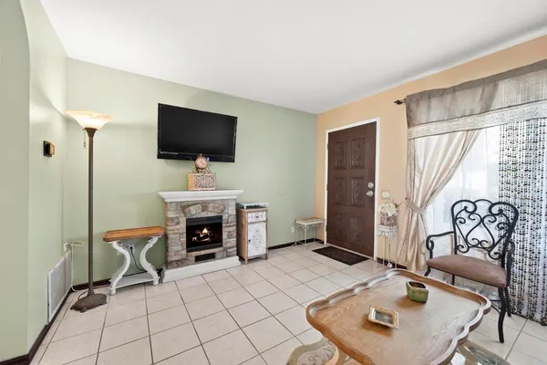 a living room with furniture and a fireplace