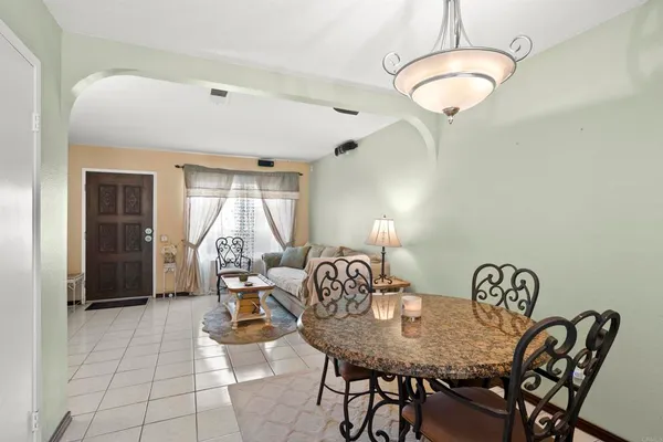 a view of an entryway with wooden floor and door
