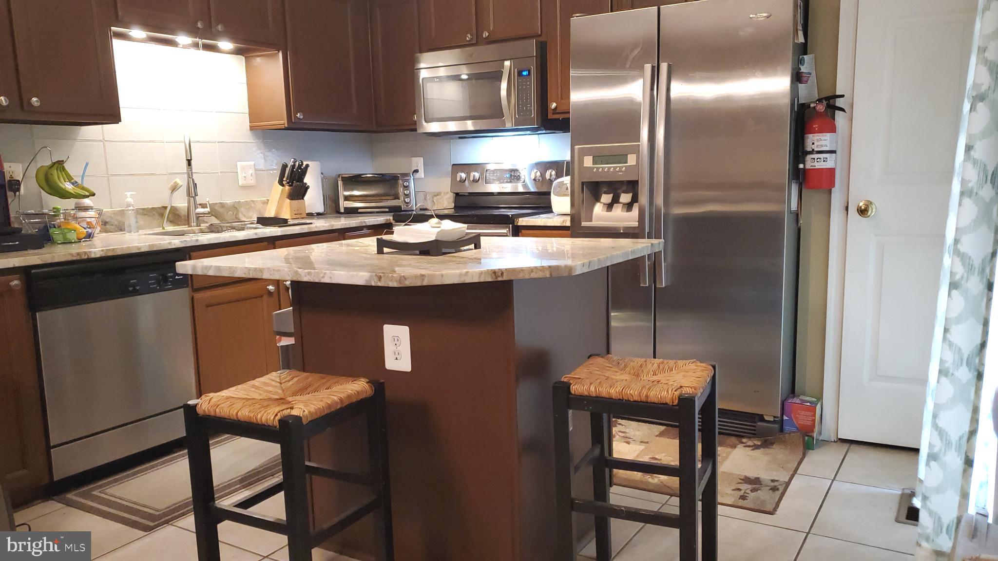 12852 Silvia Loop Woodbridge, VA 22192 - Photo 6 of 20 Remodeled kitchen with granite counters