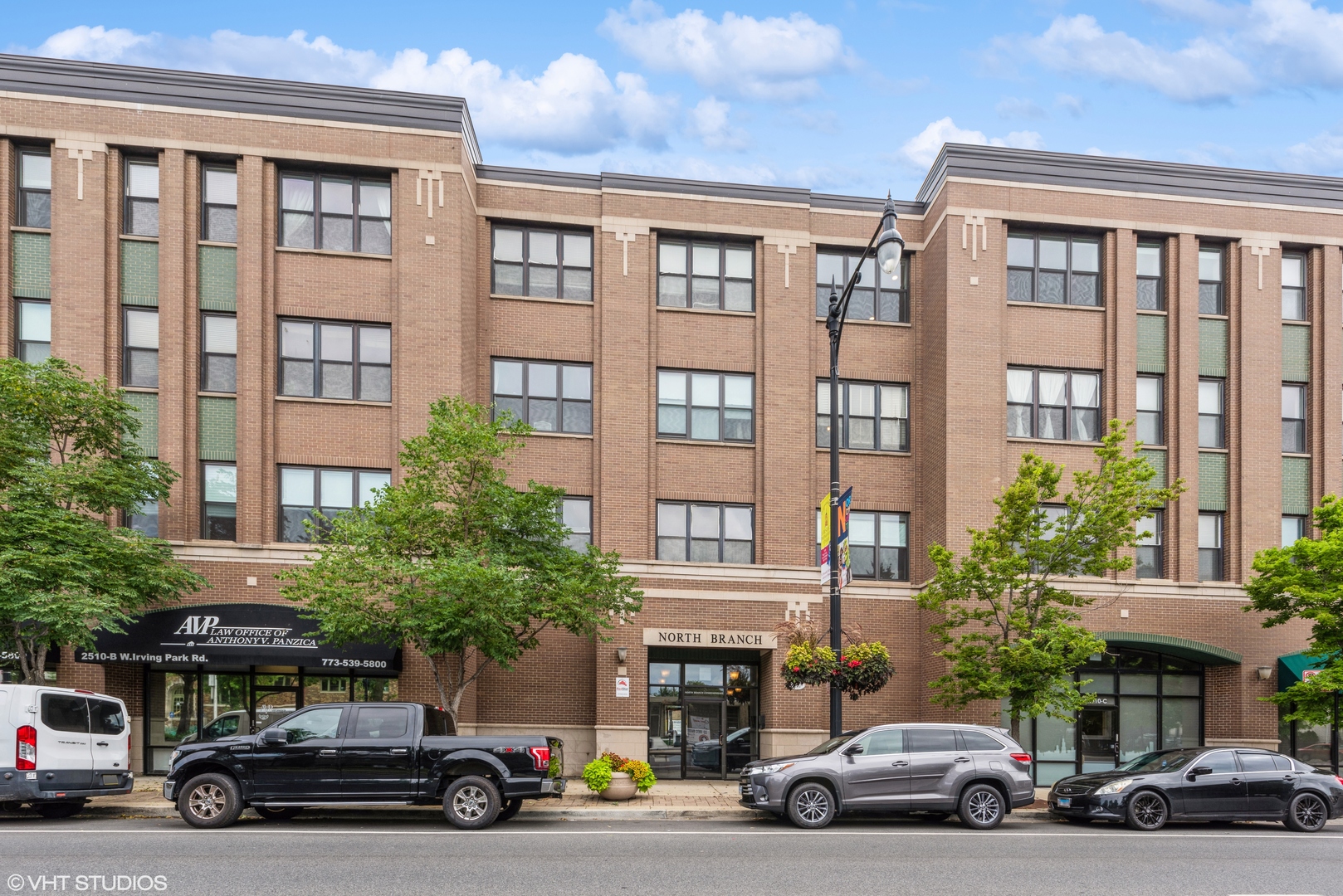 2510 West Irving Park Road, Unit 402 Chicago, IL 60618 - Photo 1 of 13 a car parked in front of a building
