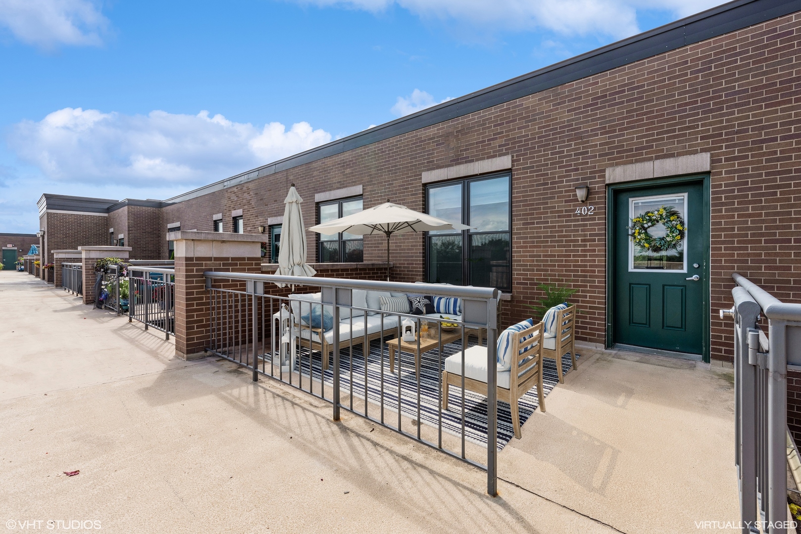2510 West Irving Park Road, Unit 402 Chicago, IL 60618 - Photo 3 of 13 a balcony with furniture