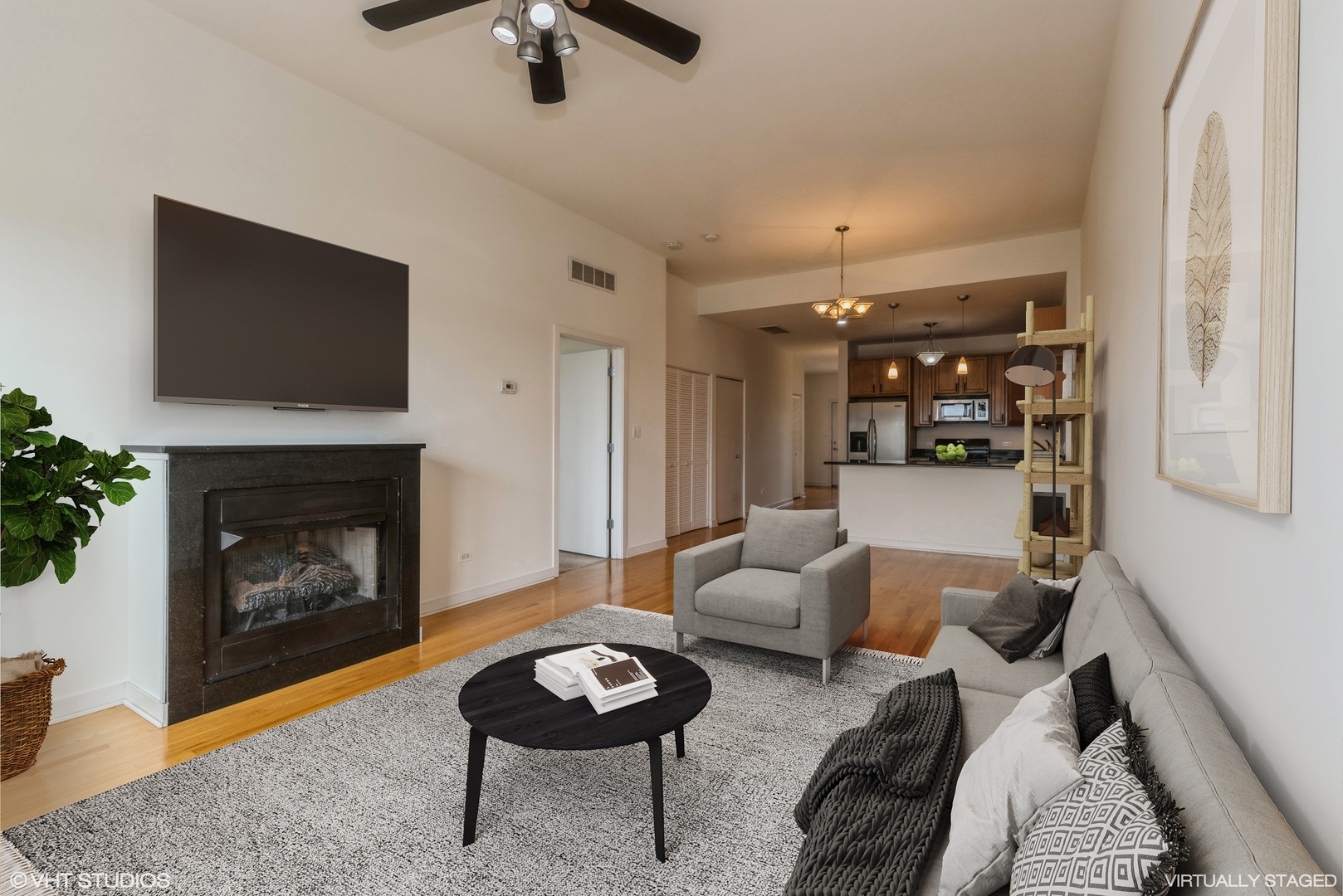 2510 West Irving Park Road, Unit 402 Chicago, IL 60618 - Photo 6 of 13 a living room with furniture and a fireplace