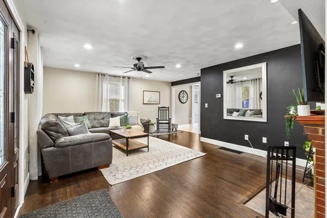 a view of a livingroom with furniture and a flat screen tv