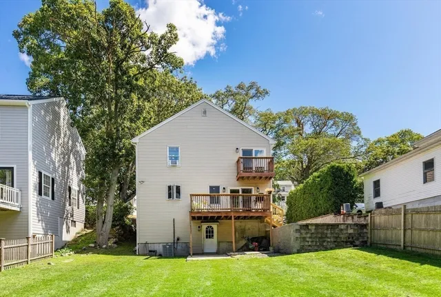 a view of backyard with barbeque grill and outdoor seating