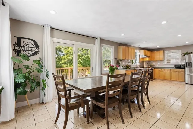 a kitchen with stainless steel appliances granite countertop a stove top oven a sink dishwasher and a refrigerator