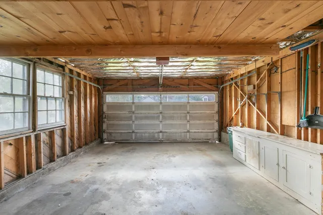 a view of an empty room with wooden walls