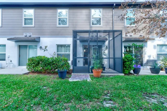 a view of a house with a yard and plants