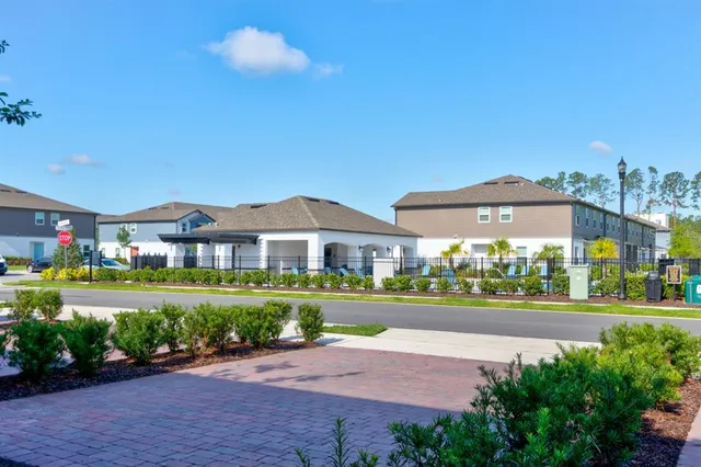 a front view of building with yard and green space