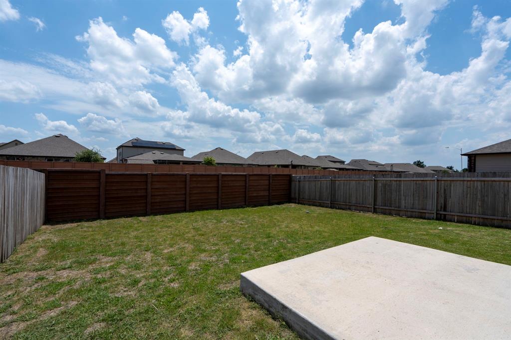 14100 Vigilance Street Manor, TX 78653 - Photo 27 of 32 a view of a backyard