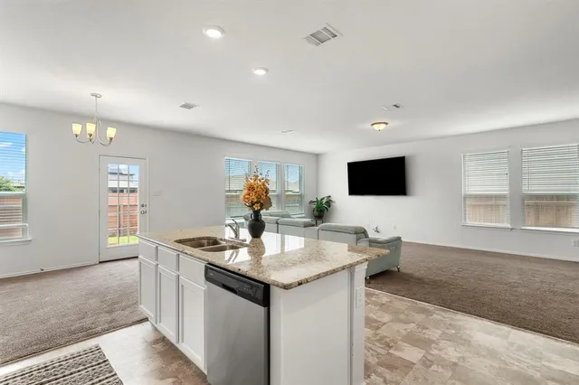 a view of a backyard with wooden fence