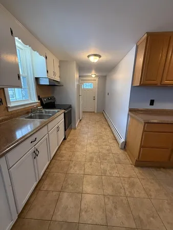 a kitchen with stainless steel appliances granite countertop a sink and cabinets