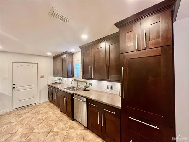 a spacious bathroom with a granite countertop sink and a mirror