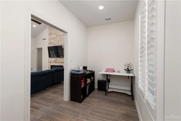 a room with furniture and wooden floor