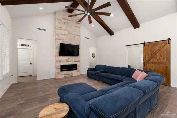 a living room with furniture and a flat screen tv