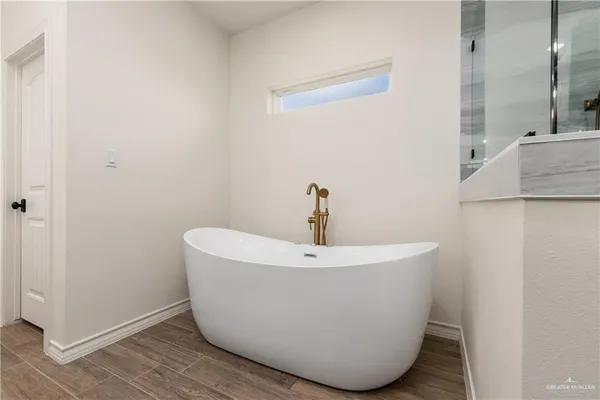 a white bath tub sitting in a bathroom